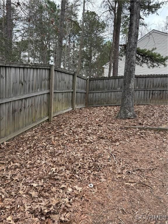 view of yard with a fenced backyard