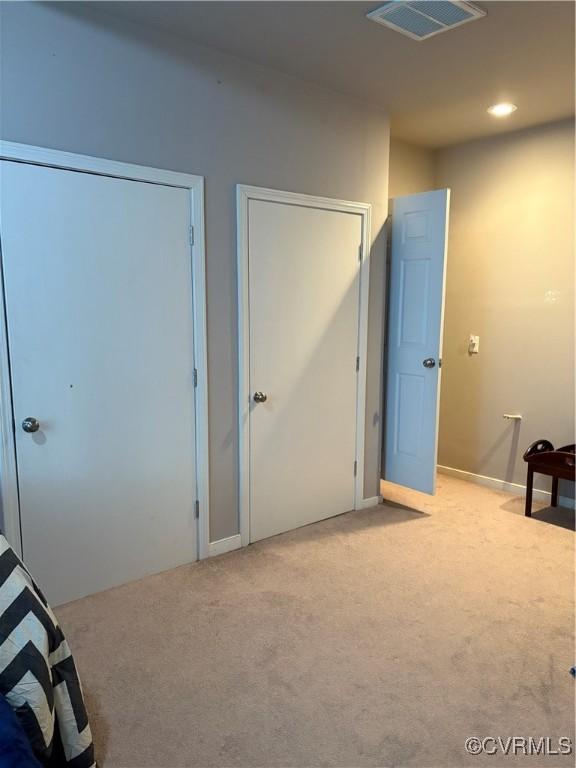 interior space with visible vents, recessed lighting, and carpet floors