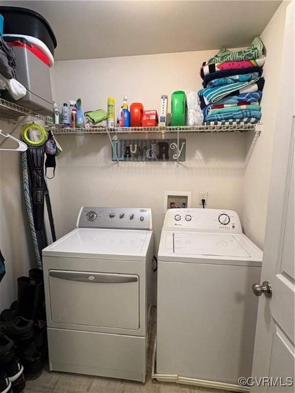 laundry area featuring laundry area and washer and clothes dryer