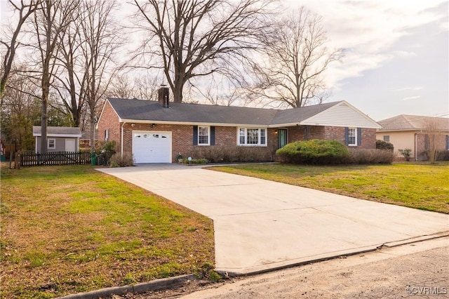 ranch-style home with fence, concrete driveway, a front yard, a garage, and brick siding