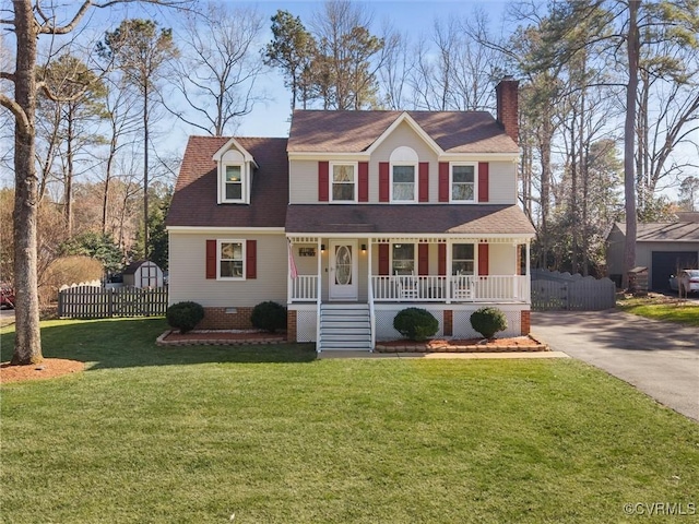 view of front of home featuring fence, roof with shingles, covered porch, a front lawn, and crawl space