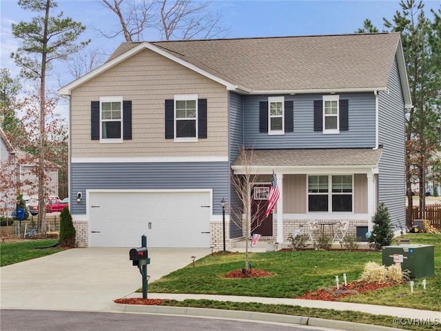 view of front facade with a front yard, fence, an attached garage, concrete driveway, and brick siding