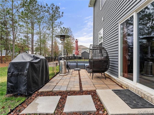 view of patio / terrace featuring area for grilling and fence