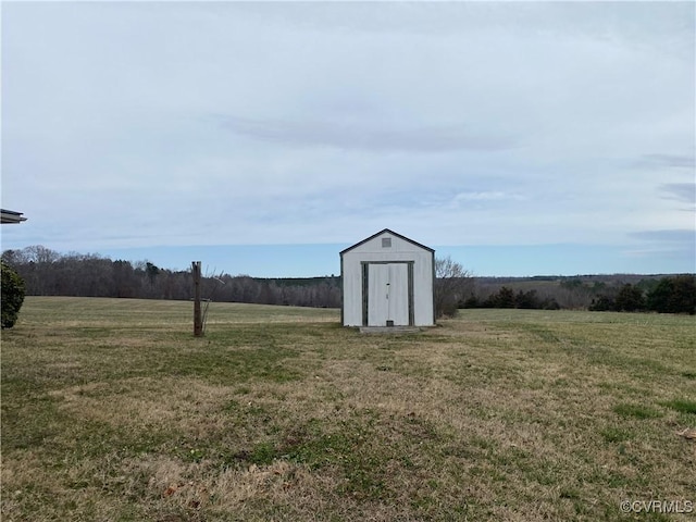 view of yard with a shed and an outdoor structure