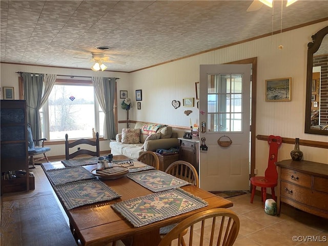 dining space featuring visible vents, ceiling fan, and ornamental molding