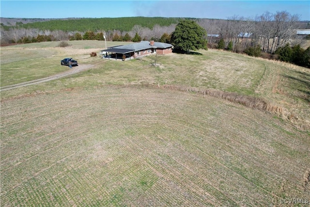 birds eye view of property with a rural view