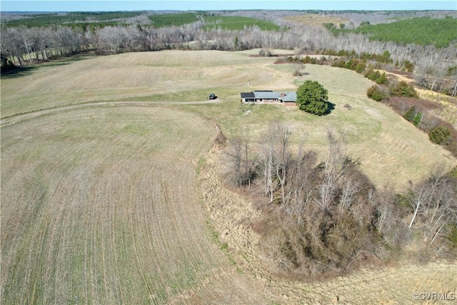 birds eye view of property with a rural view