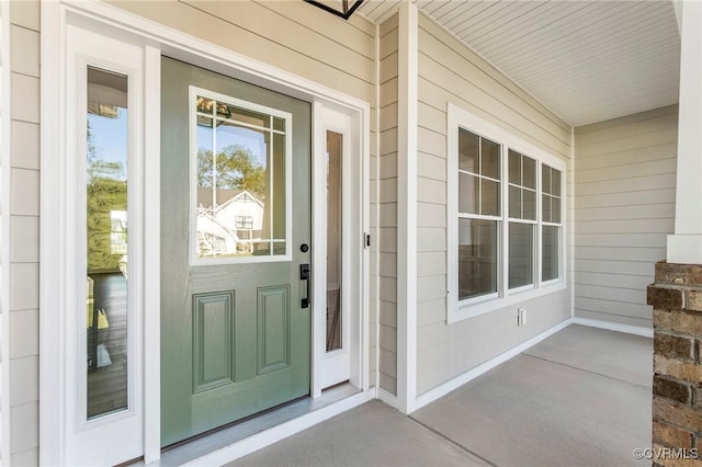 property entrance featuring a porch