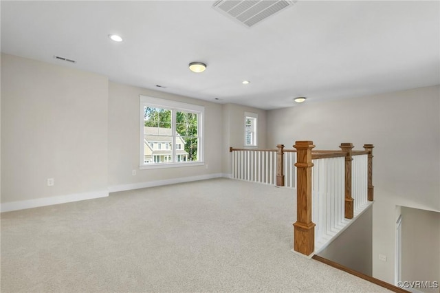 unfurnished room featuring recessed lighting, baseboards, visible vents, and carpet floors