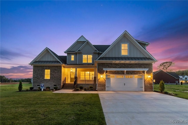 craftsman inspired home with covered porch, board and batten siding, brick siding, and a standing seam roof