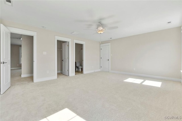 unfurnished bedroom with light carpet, visible vents, and baseboards