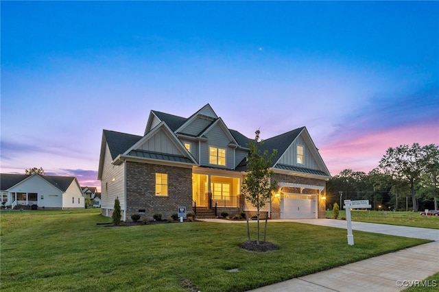 craftsman inspired home with a front yard, a standing seam roof, concrete driveway, board and batten siding, and brick siding