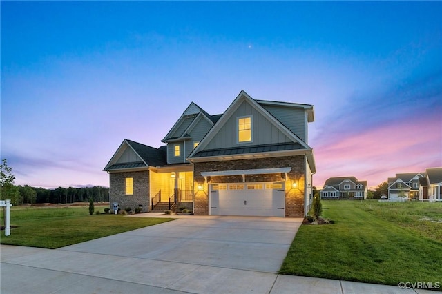 craftsman-style home with a standing seam roof, concrete driveway, brick siding, and a front lawn