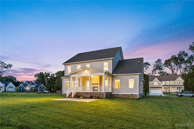 exterior space featuring crawl space, a porch, and a front lawn