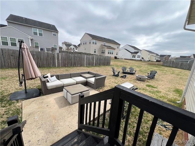 view of yard with a patio area, a residential view, an outdoor living space with a fire pit, and a fenced backyard