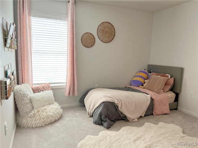 carpeted bedroom with baseboards