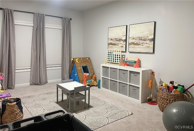 rec room with light colored carpet