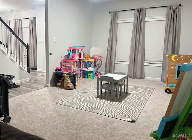 playroom with baseboards and carpet floors