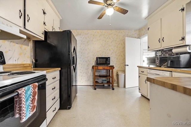 kitchen with wallpapered walls, ceiling fan, under cabinet range hood, black appliances, and wood counters