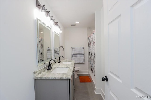 545 Lock Ln, Petersburg, VA 23805 - bathroom with tile patterned floors, double vanity, recessed lighting, and a shower with shower curtain