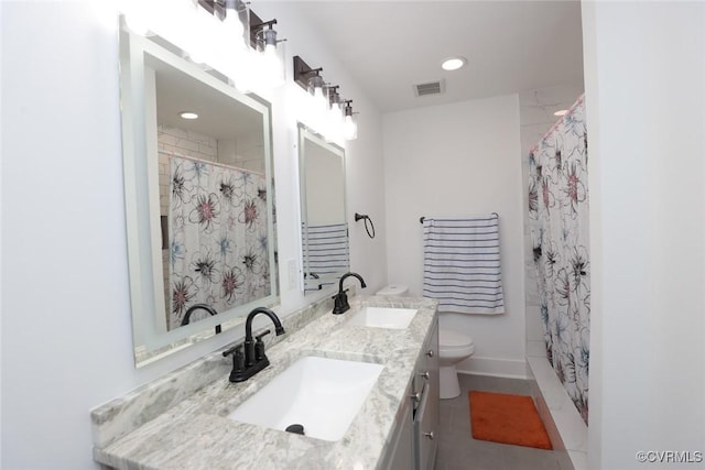 545 Lock Ln, Petersburg, VA 23805 - bathroom with double vanity, curtained shower, and recessed lighting