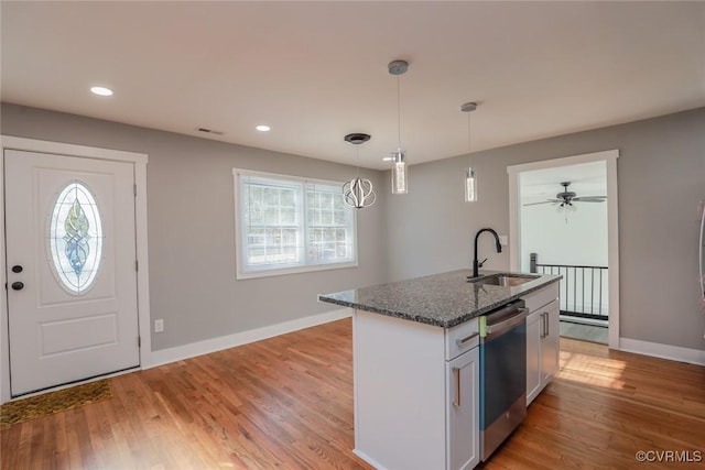 545 Lock Ln, Petersburg, VA 23805 - kitchen with stainless steel dishwasher, healthy amount of natural light, dark stone counters, decorative light fixtures, and recessed lighting