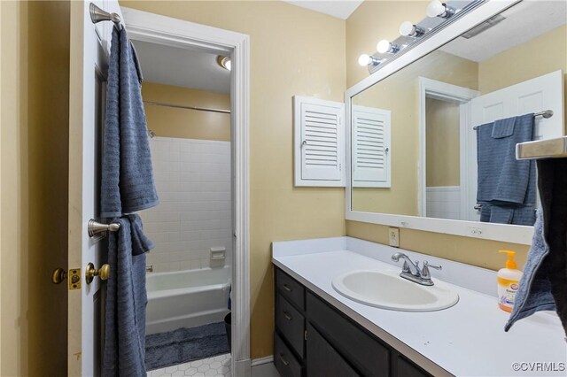 full bathroom with vanity, visible vents, and shower / bath combination