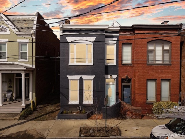 view of property with brick siding