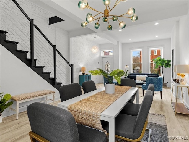 dining room featuring stairs, plenty of natural light, recessed lighting, and light wood-type flooring