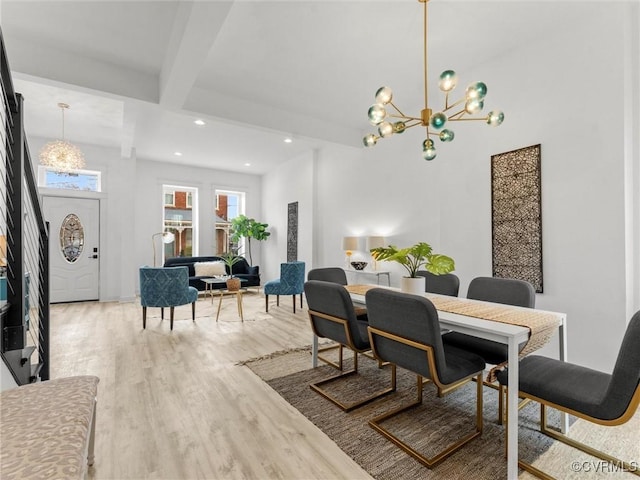 dining room featuring beam ceiling, recessed lighting, an inviting chandelier, and wood finished floors