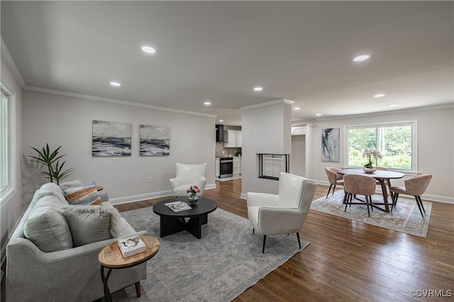 living room with dark wood finished floors, recessed lighting, crown molding, and baseboards