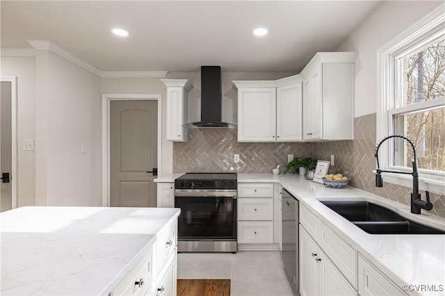 kitchen with a sink, electric range oven, white cabinetry, wall chimney exhaust hood, and dishwasher