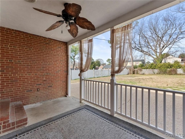 view of patio / terrace featuring ceiling fan and fence