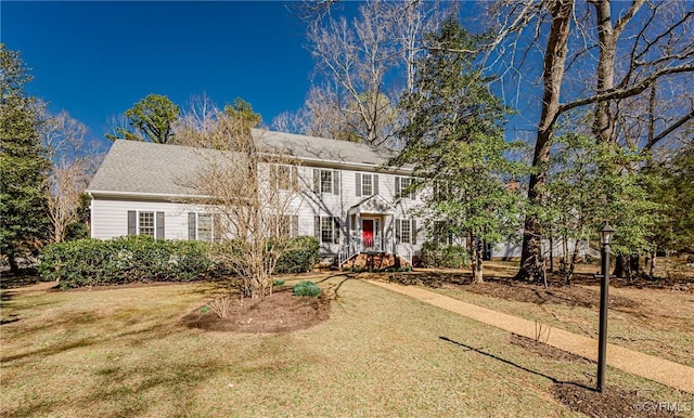 colonial inspired home with a front yard