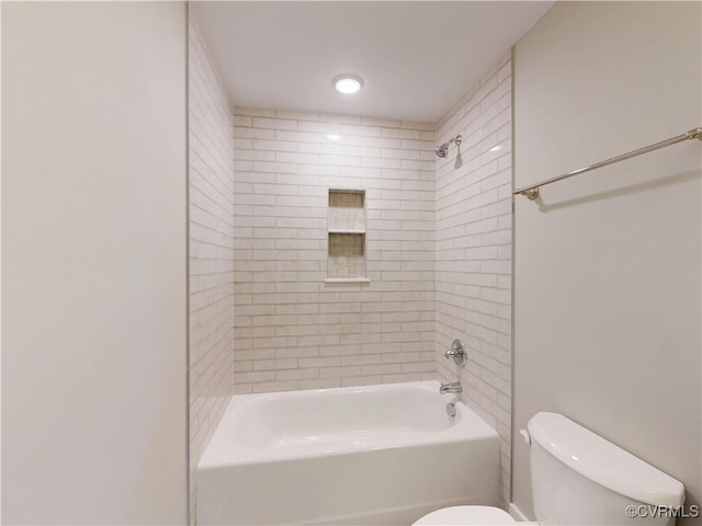 bathroom featuring bathing tub / shower combination and toilet