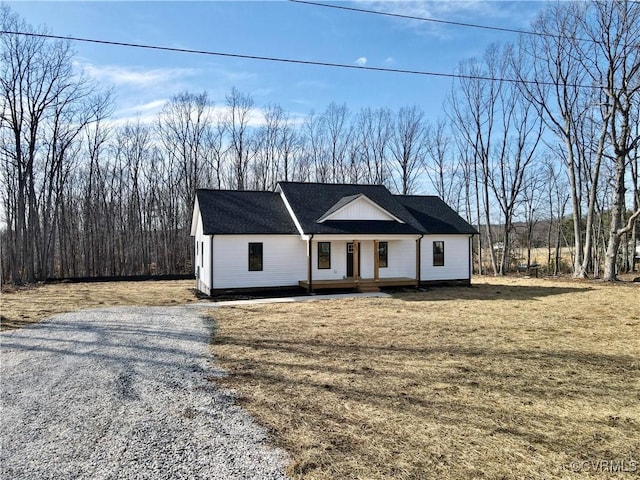 modern farmhouse with covered porch and driveway