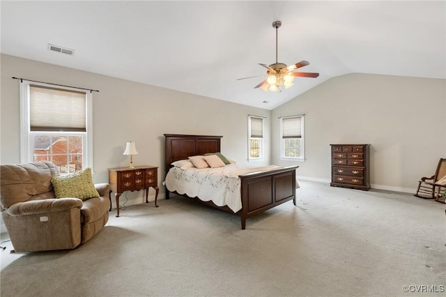 bedroom with visible vents, light carpet, lofted ceiling, a ceiling fan, and baseboards