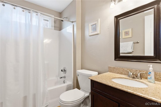 bathroom featuring toilet, vanity, and shower / bath combo