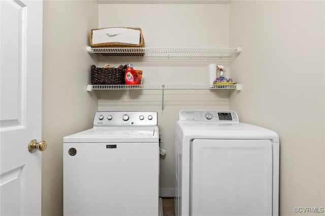 washroom featuring washer and dryer and laundry area