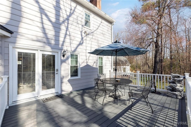 wooden deck with outdoor dining space