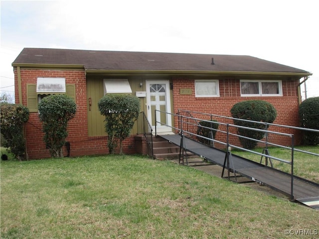 ranch-style home with brick siding and a front lawn