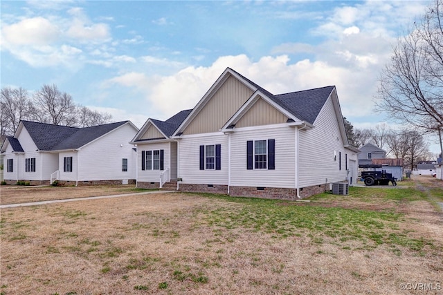 view of front facade with crawl space, a front lawn, and entry steps