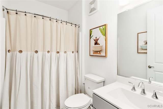 full bathroom featuring toilet and vanity