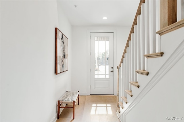 entrance foyer featuring stairway, recessed lighting, baseboards, and wood finished floors