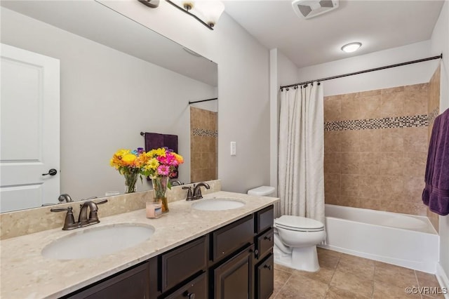 full bathroom with tile patterned flooring, visible vents, toilet, and a sink