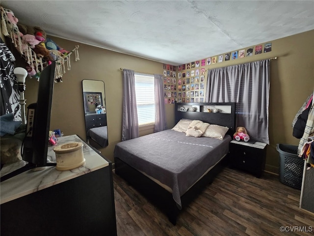 bedroom featuring wood finished floors