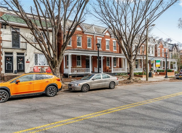 multi unit property with a residential view and brick siding