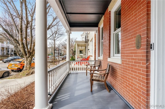 balcony featuring a porch