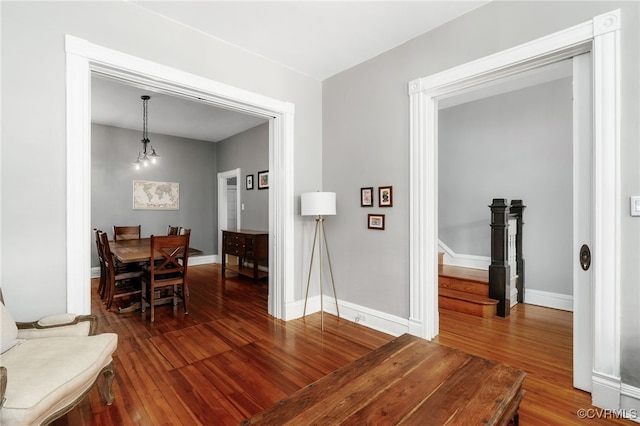 dining room with baseboards and wood finished floors