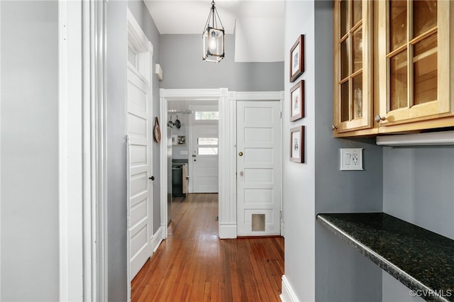 hallway with dark wood-type flooring